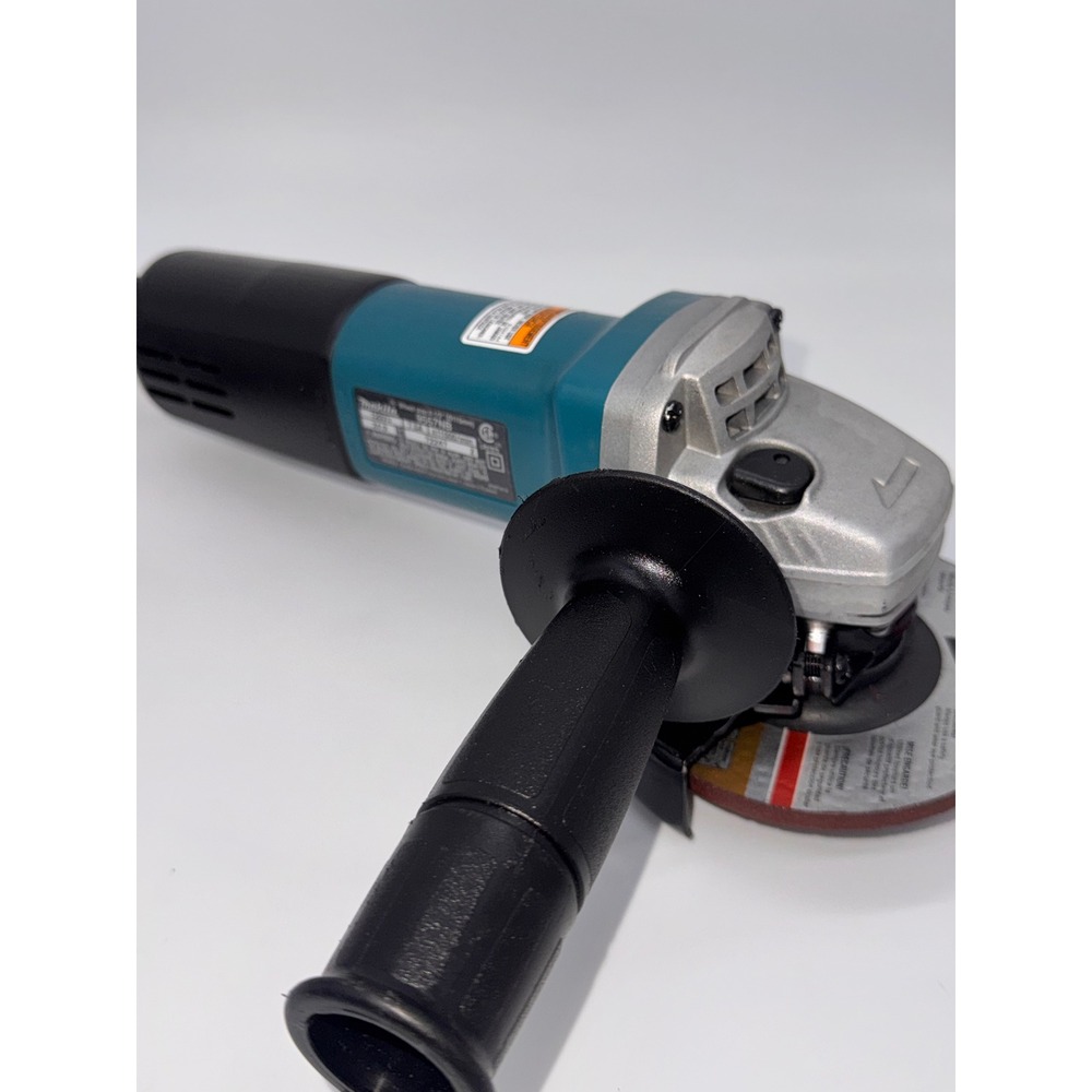 Makita 9557NB 4-1/2 Inch Corded Angle Grinder 7.5A 11000 RPM Teal Black - Picture 1 of 8